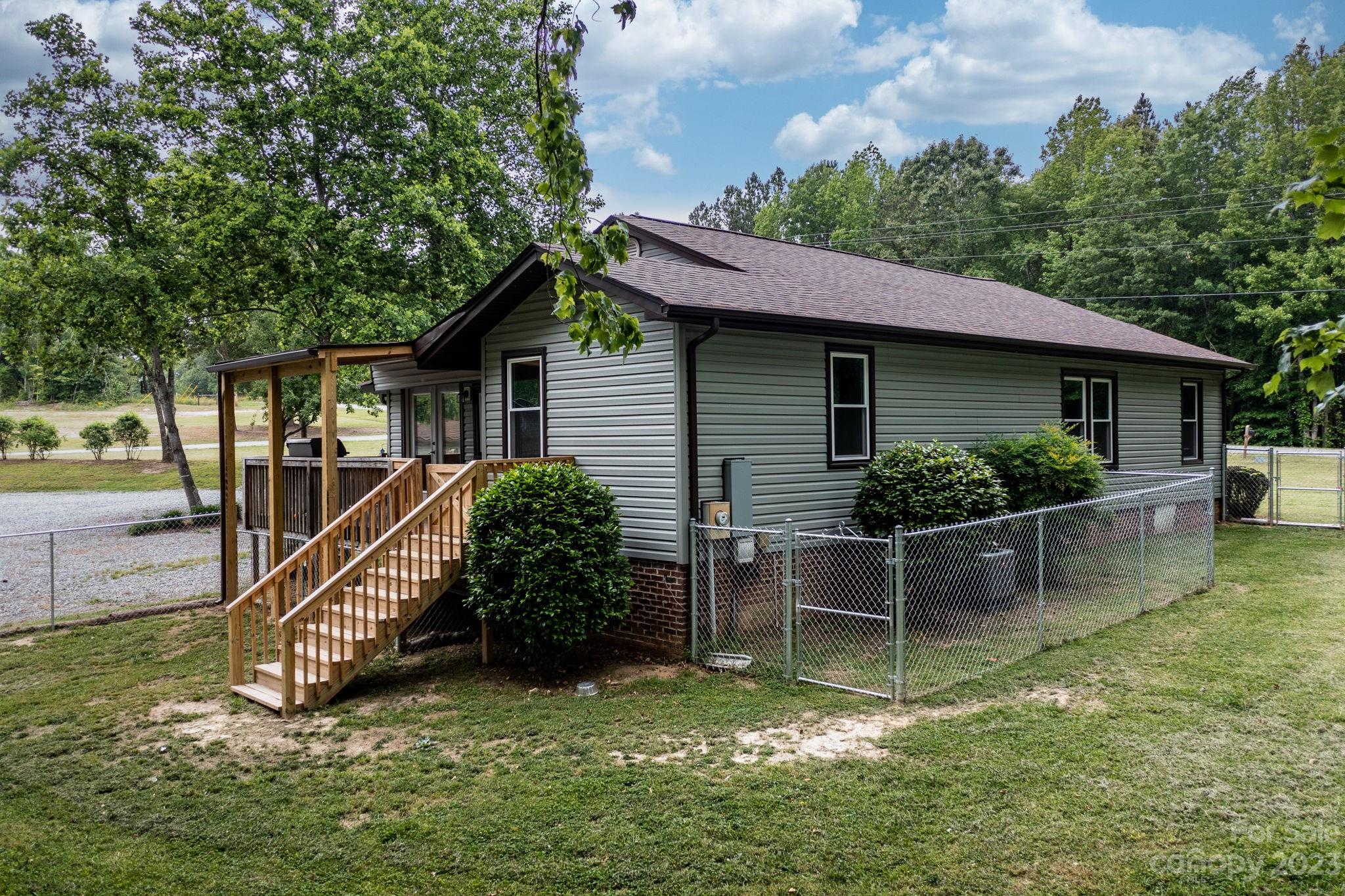 1335 Hill Road Lincolnton, NC 28092 - Photo 7 of 38 a view of a house with a yard and sitting area