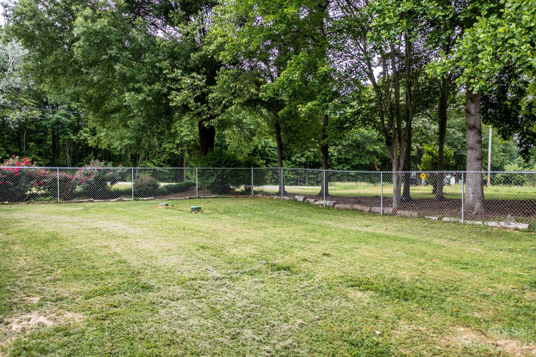 1335 Hill Road Lincolnton, NC 28092 - Photo 8 of 38 a backyard of a house with lots of green space