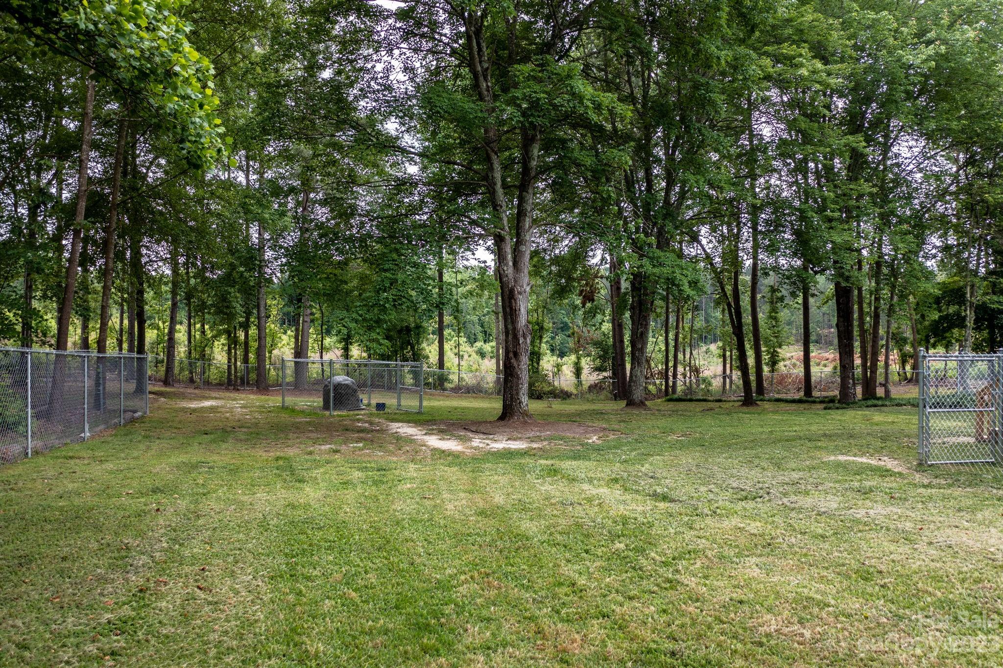 1335 Hill Road Lincolnton, NC 28092 - Photo 9 of 38 a backyard of a house with lots of green space and fountain