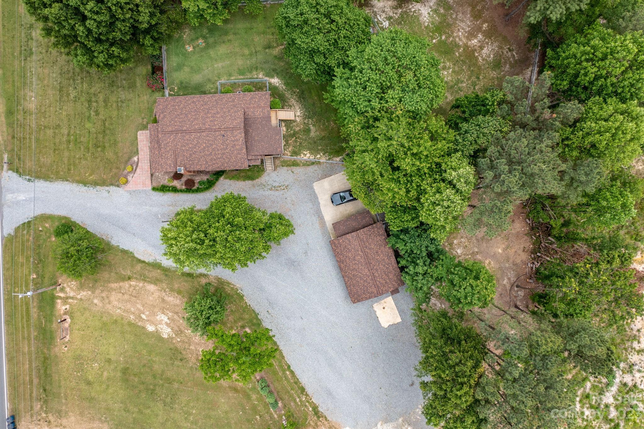 1335 Hill Road Lincolnton, NC 28092 - Photo 10 of 38 an aerial view of a house with garden space and a car parked on street