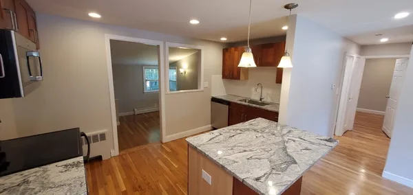 a bathroom with a sink a vanity and shower