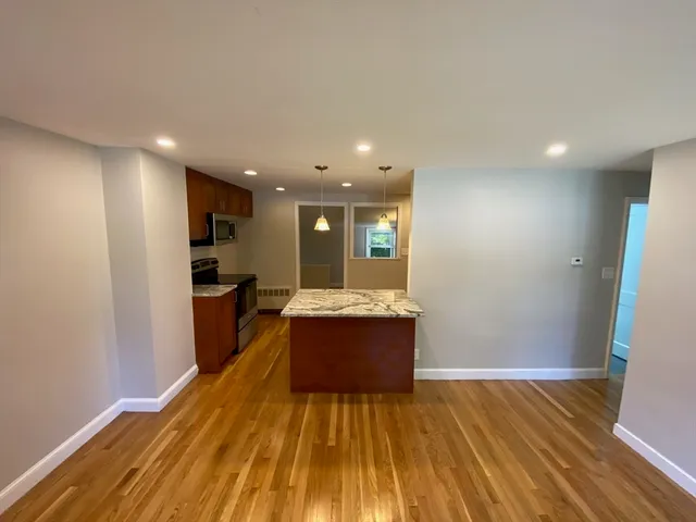 a view of kitchen and wooden floor