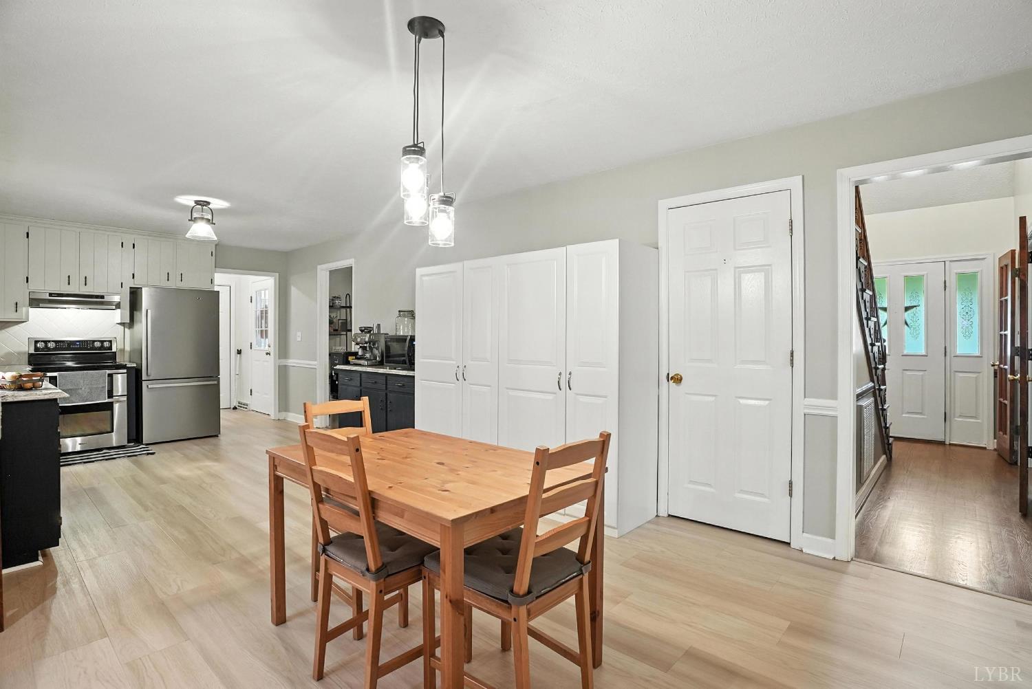 69 Gough Road Rustburg, VA 24588 - Photo 20 of 61 a view of a dining room with furniture and wooden floor