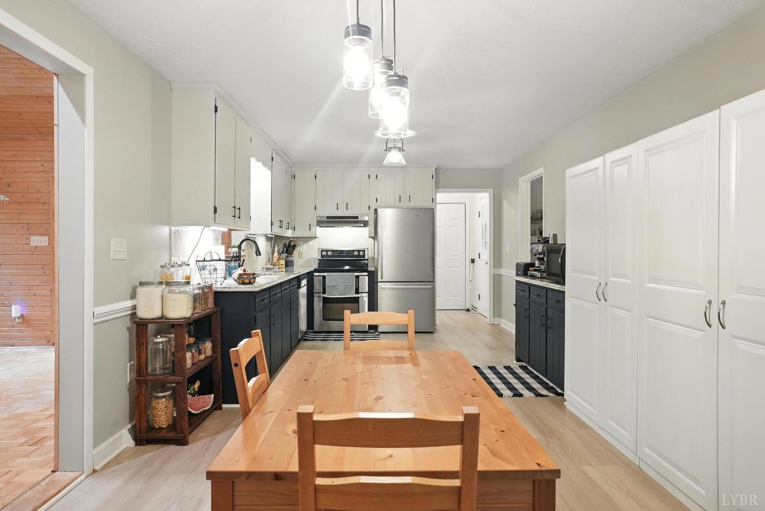 69 Gough Road Rustburg, VA 24588 - Photo 21 of 61 a kitchen with kitchen island a stove a refrigerator and a dining table