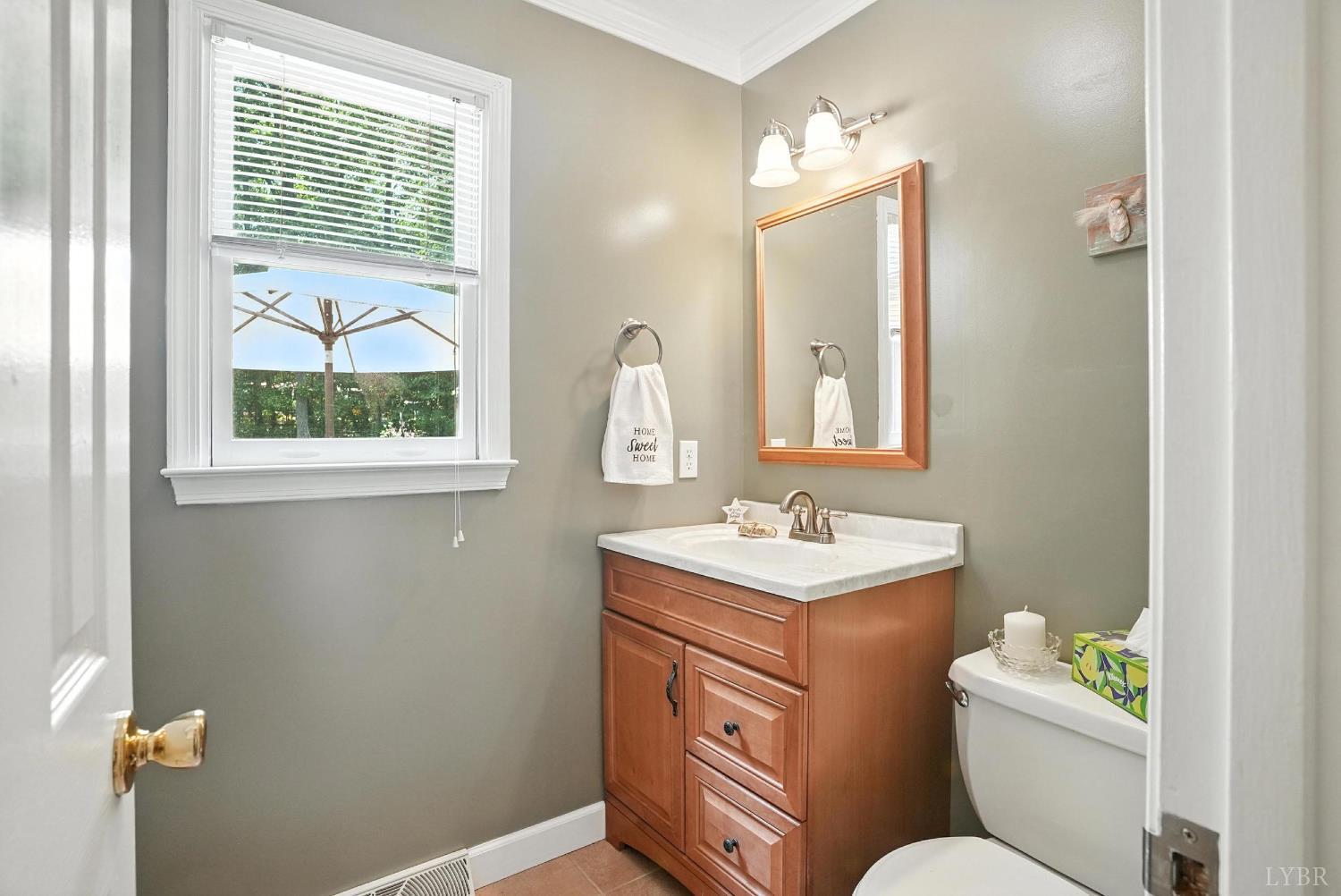 69 Gough Road Rustburg, VA 24588 - Photo 29 of 61 a bathroom with a toilet sink and mirror