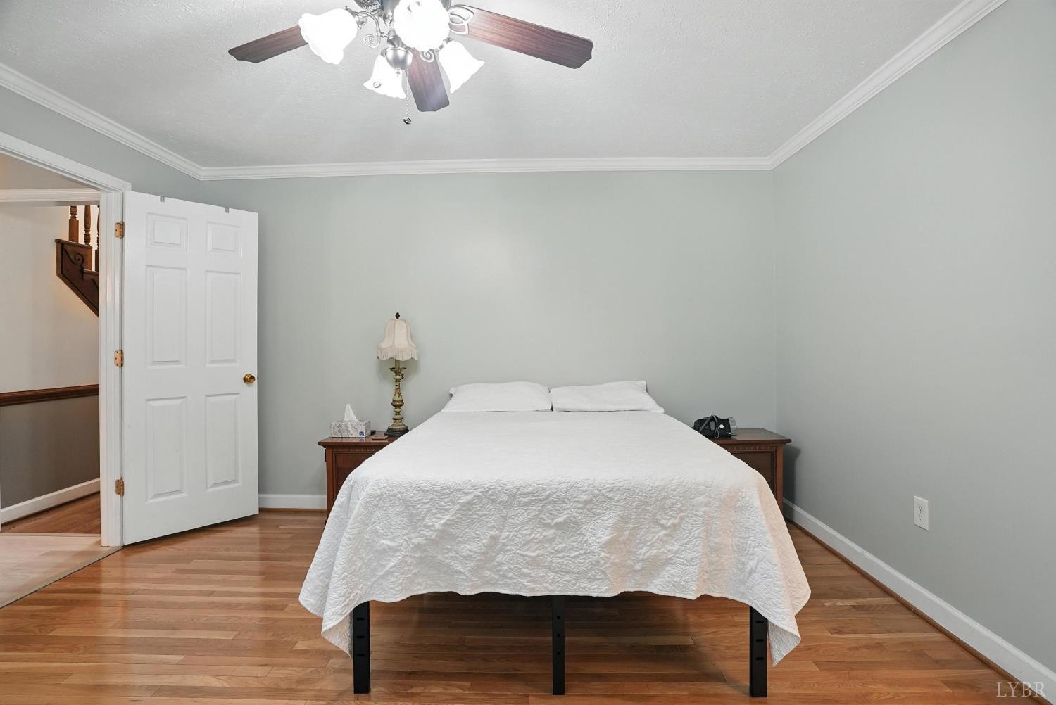 69 Gough Road Rustburg, VA 24588 - Photo 31 of 61 a bedroom with a bed and wooden floor