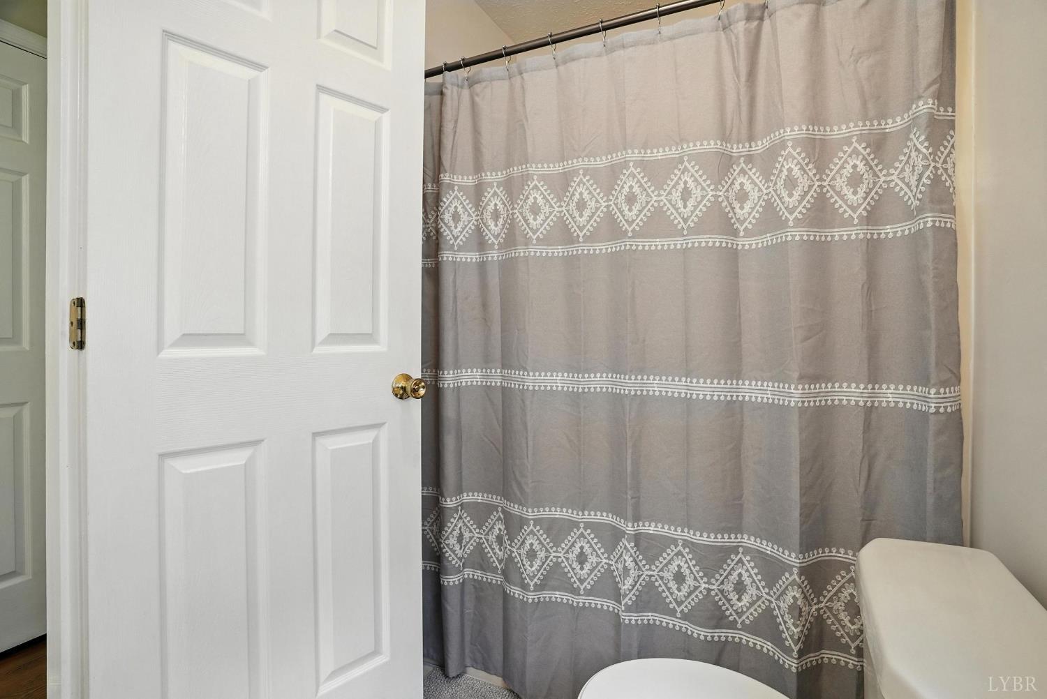 69 Gough Road Rustburg, VA 24588 - Photo 37 of 61 a living room with furniture and a curtain