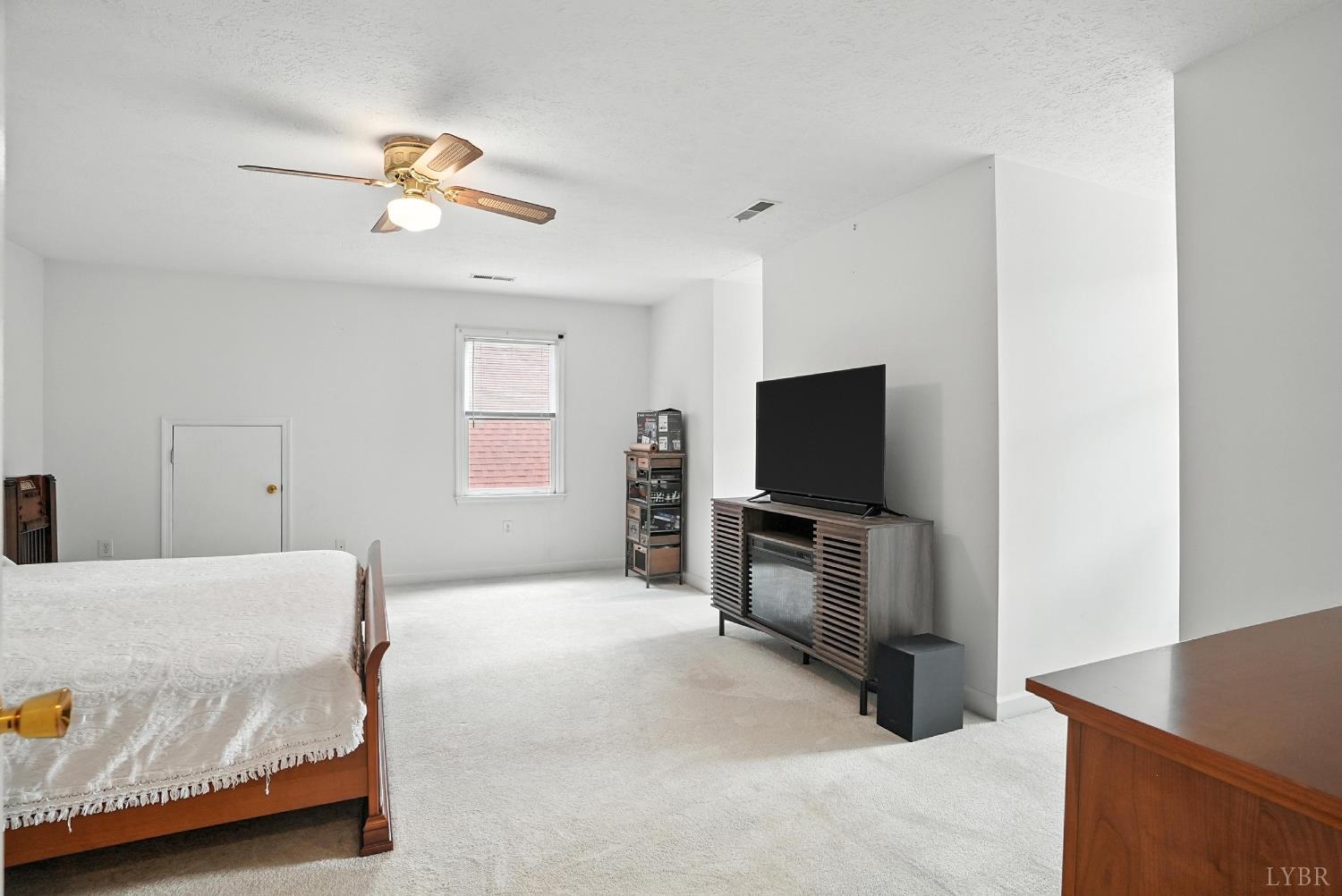 69 Gough Road Rustburg, VA 24588 - Photo 41 of 61 a bedroom with a bed and flat screen tv