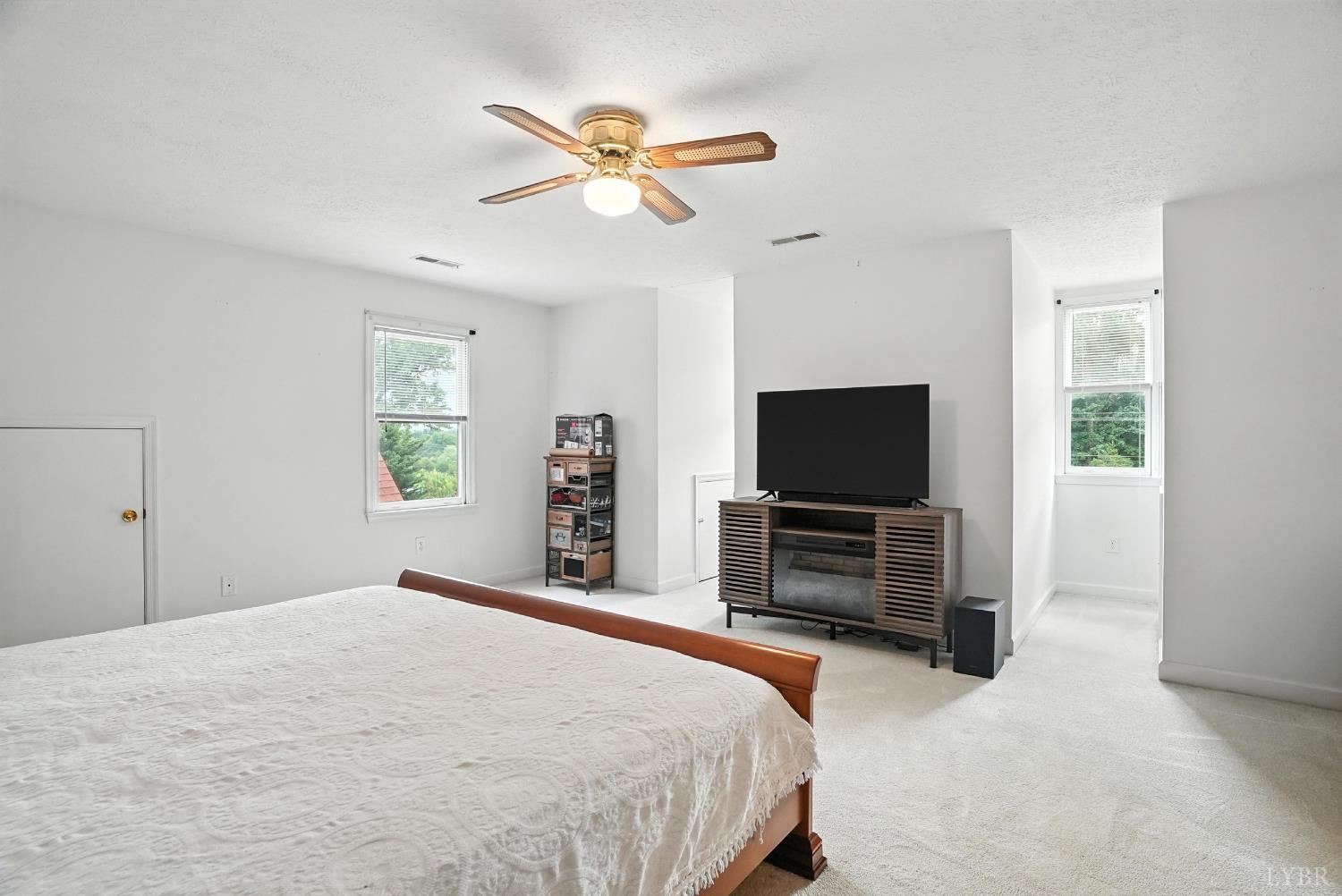 69 Gough Road Rustburg, VA 24588 - Photo 42 of 61 a bedroom with a bed and a flat screen tv