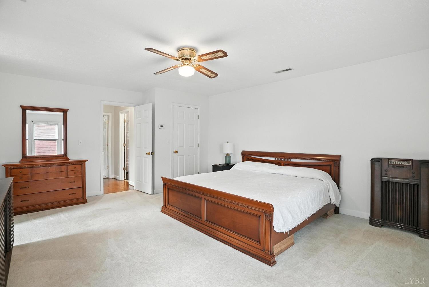 69 Gough Road Rustburg, VA 24588 - Photo 44 of 61 a spacious bedroom with a bed and cabinet
