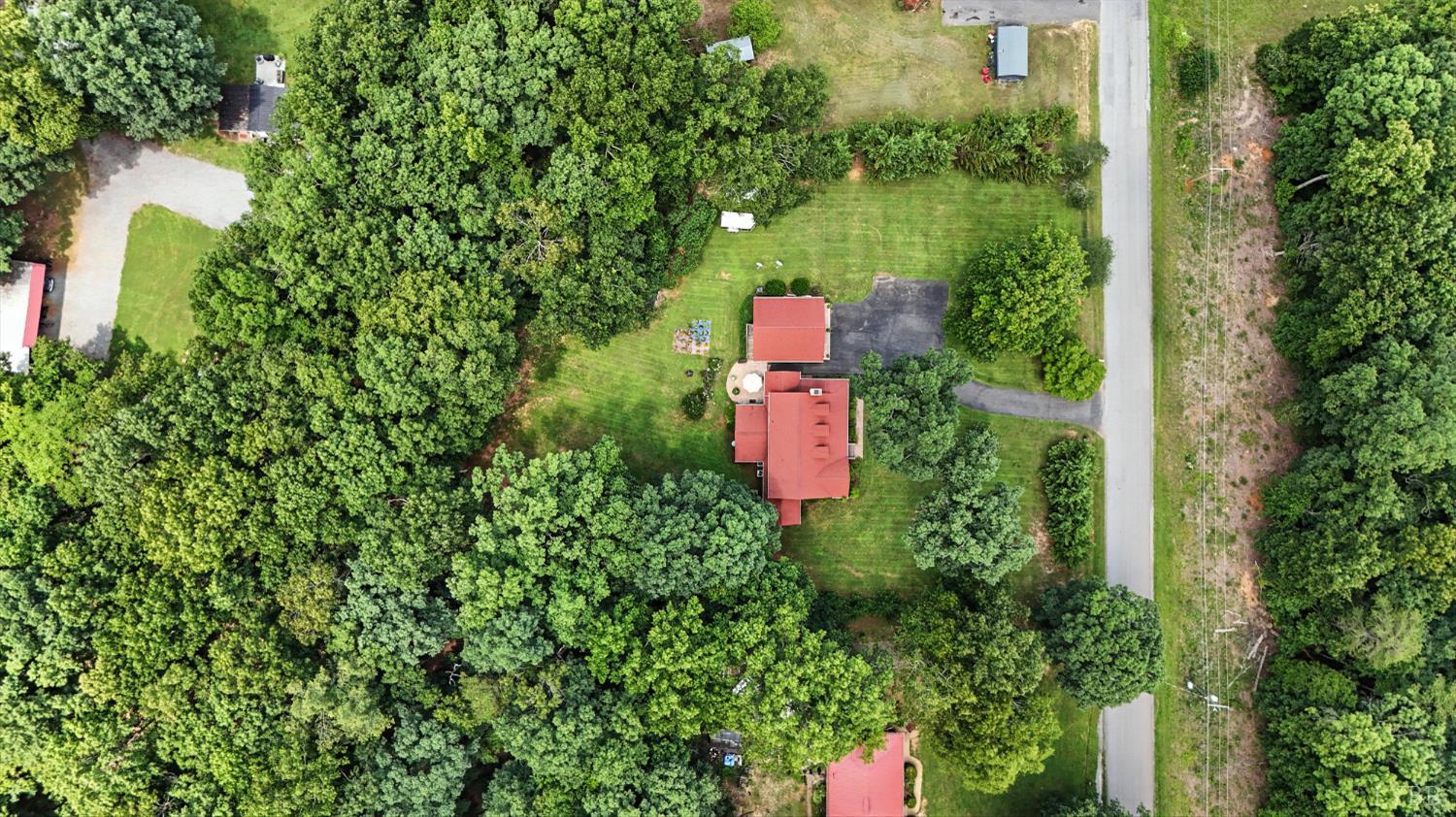 69 Gough Road Rustburg, VA 24588 - Photo 54 of 61 an aerial view of a house with a yard and outdoor seating