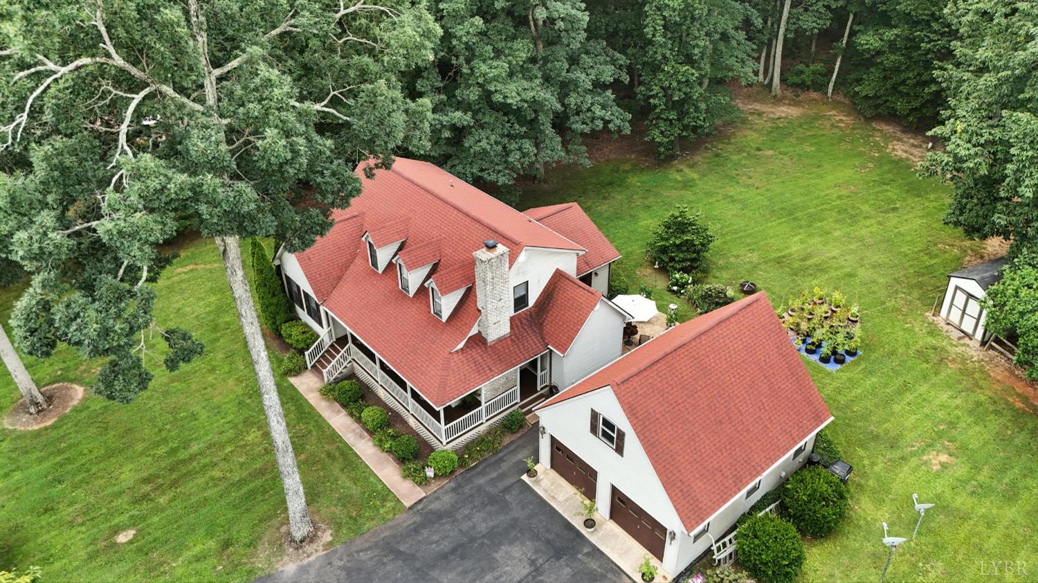 69 Gough Road Rustburg, VA 24588 - Photo 56 of 61 an aerial view of a tennis ground with a large trees
