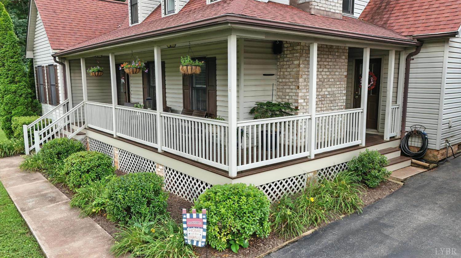 69 Gough Road Rustburg, VA 24588 - Photo 58 of 61 a view of a house with a small yard and flower plants