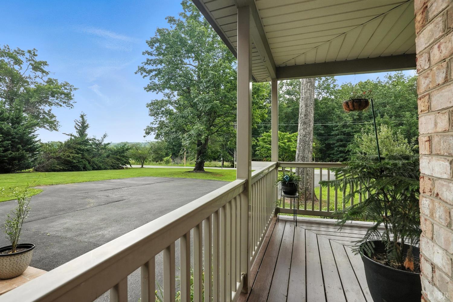 69 Gough Road Rustburg, VA 24588 - Photo 8 of 61 a view of a wooden deck next to a yard