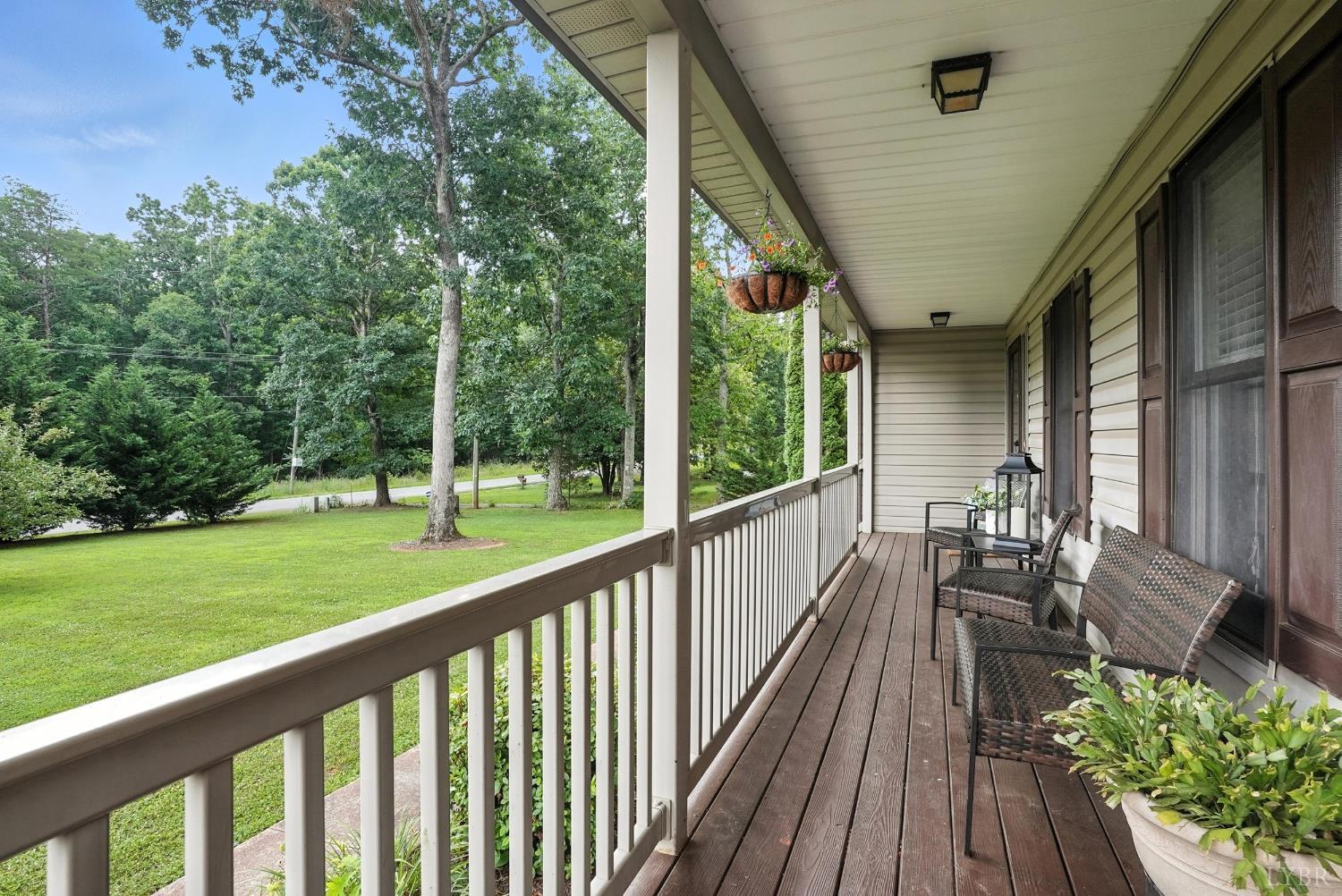 69 Gough Road Rustburg, VA 24588 - Photo 9 of 61 a view of a chair and tables in the balcony