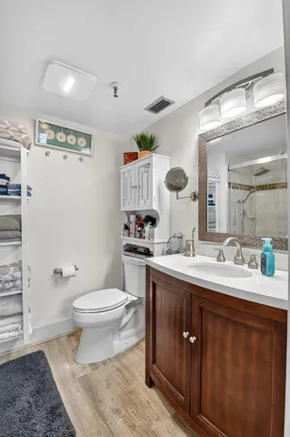 a bathroom with a shower and a toilet
