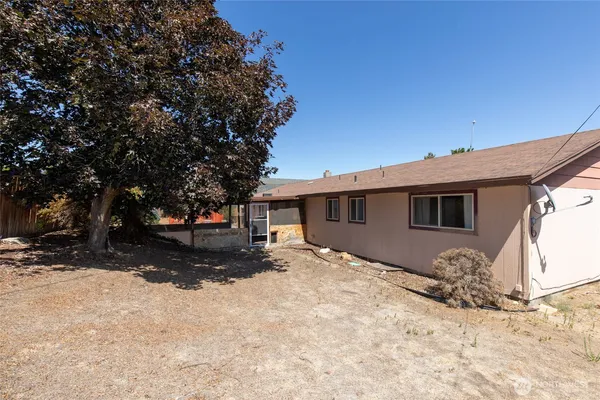 a view of a house with a snow in the yard
