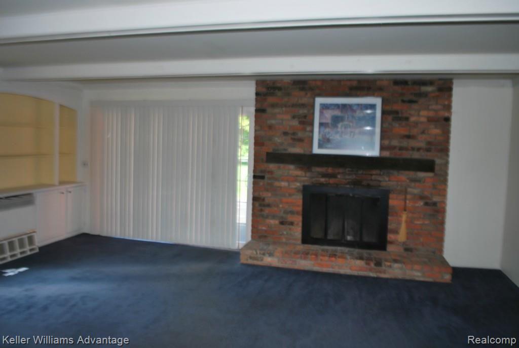 Spacious family room with built in cabinets
