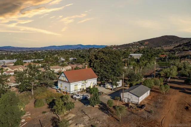 an aerial view of a house with a garden