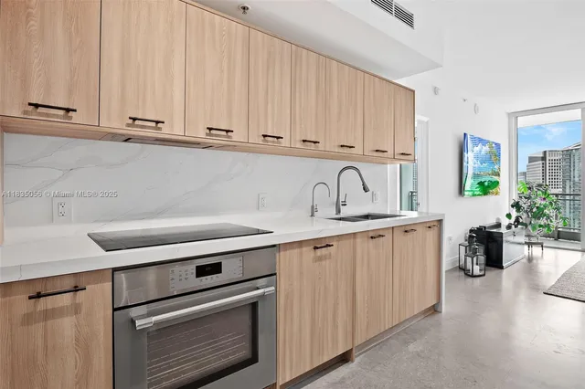a white refrigerator freezer and a dishwasher