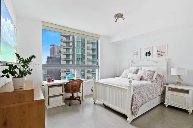 a bathroom with a sink toilet a mirror and shower
