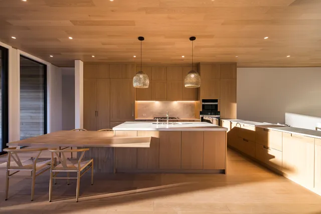 a kitchen with stainless steel appliances granite countertop a stove and a refrigerator