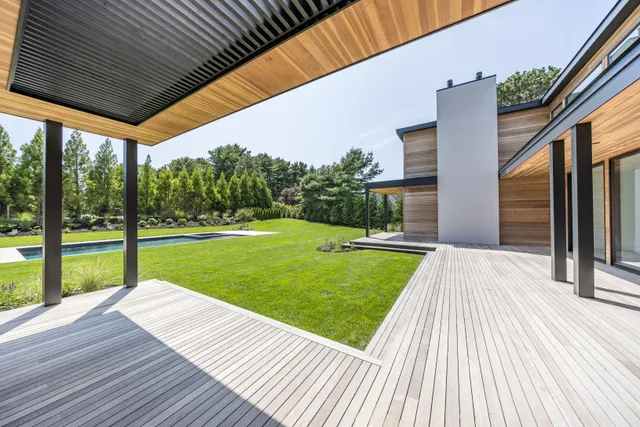 a view of a yard with a swimming pool