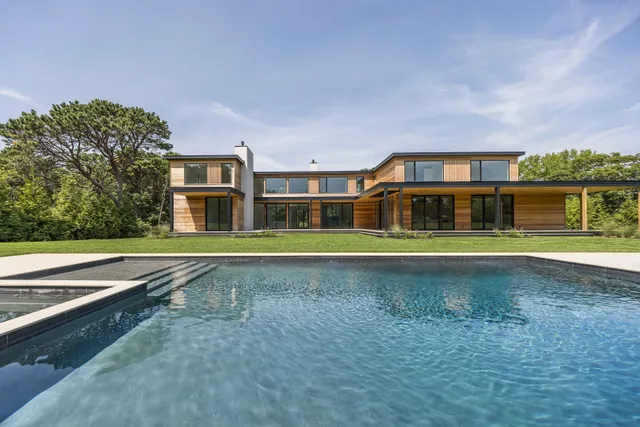 a front view of house with a garden