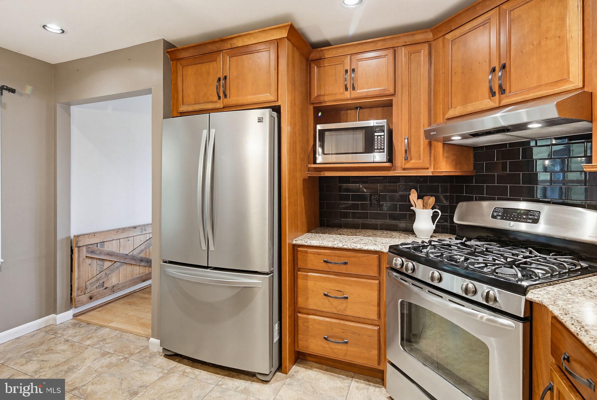 1124 Wynbrook Road Glen Burnie, MD 21060 - Photo 9 of 32 Modern kitchen with warm wood tones.