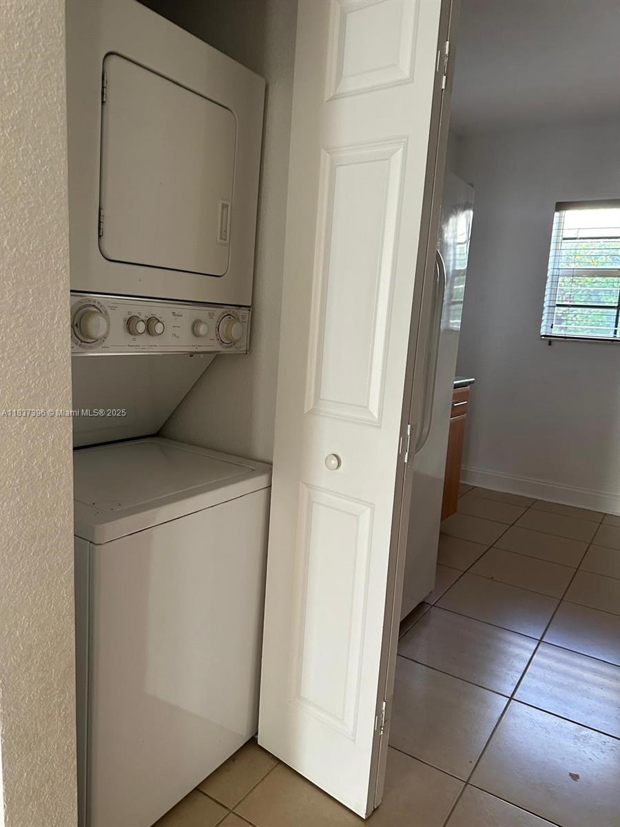 1065 97th Street, Unit 1A Bay Harbor Islands, FL 33154 - Photo 7 of 14 a utility room with dryer and washer
