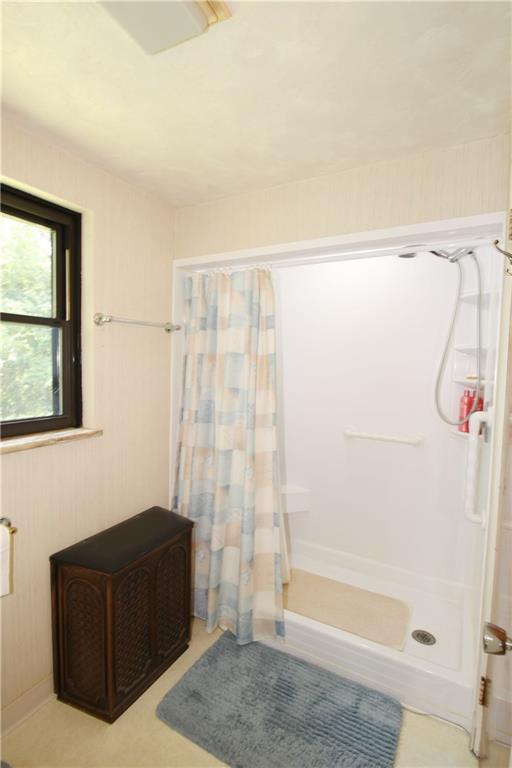 366 Moon Clinton Road Coraopolis, PA 15108 - Photo 11 of 21 a bathroom with a shower curtain and a window