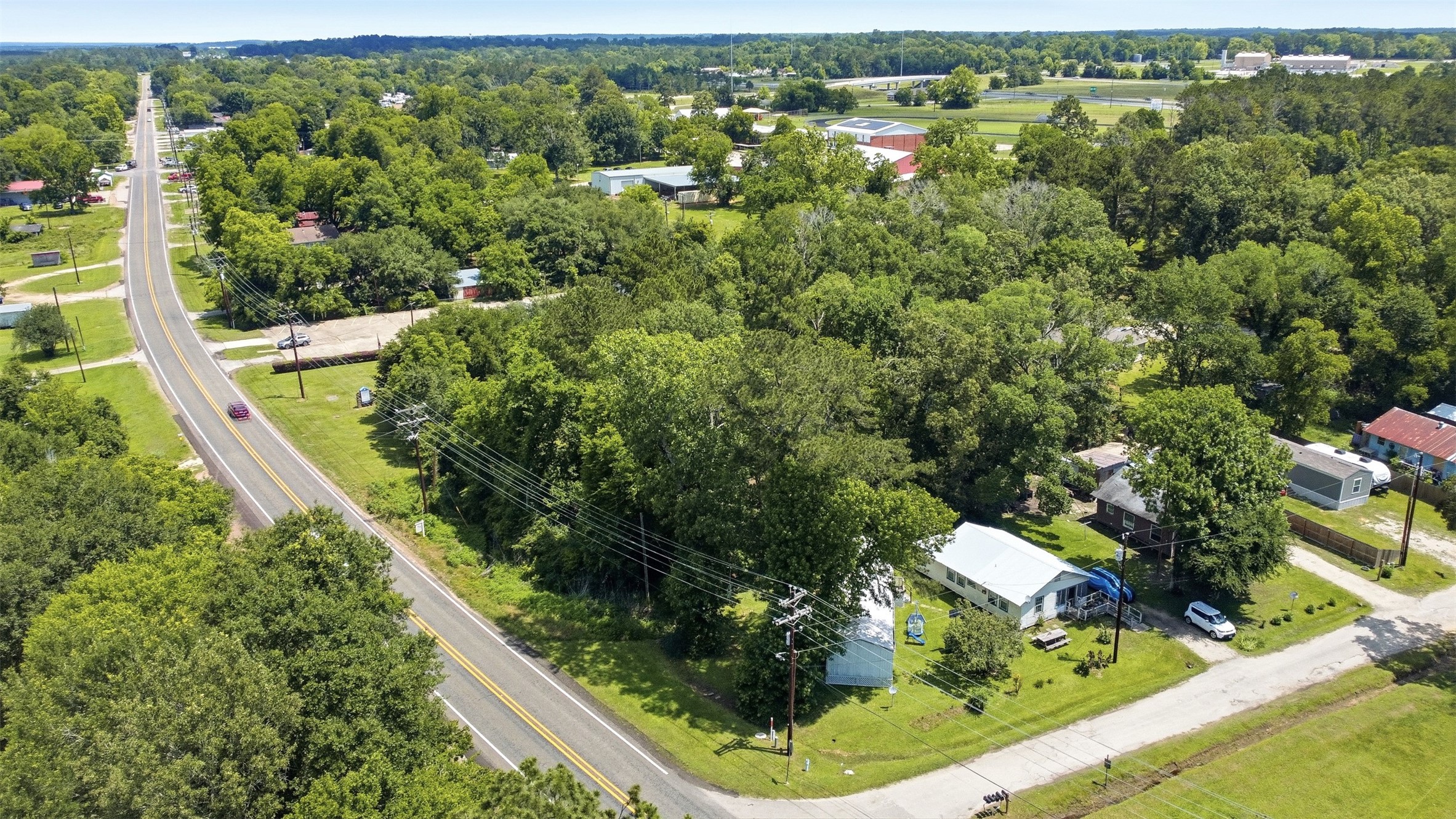 0 State Highway Loop Goodrich, TX 77335 - Photo 15 of 22 an aerial view of a house with a yard and outdoor seating