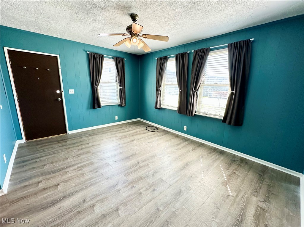 87 R 26th Street Wellsburg, WV 26070 - Photo 2 of 17 Living room featuring a ceiling fan