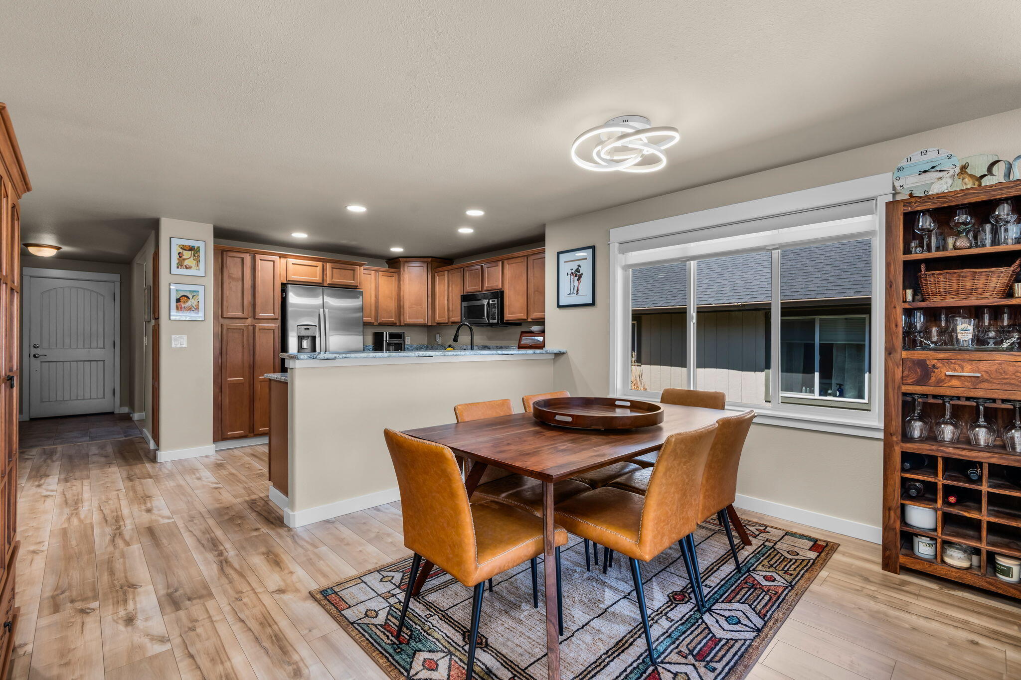 3714 Southwest 29th Street Redmond, OR 97756 - Photo 10 of 21 a dining room with furniture and a floor to ceiling window