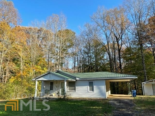 2899 Avalon Road Martin, GA 30557 - Photo 1 of 1 a front view of a house with garden