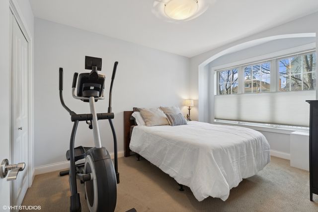 a bedroom with bed and window