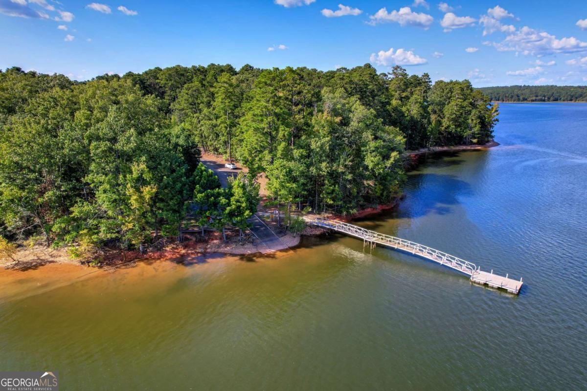 1416 Rock Point Cove Tignall, GA 30668 - Photo 13 of 16 a view of a lake with a city