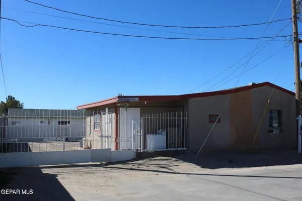 a black car parked in front of house