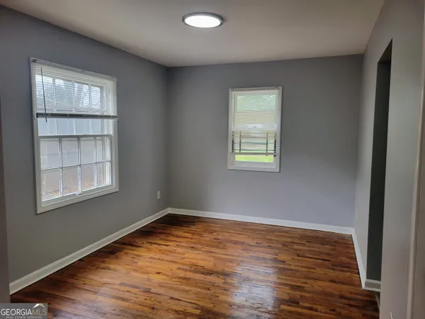 a kitchen with a white cabinets and white appliances