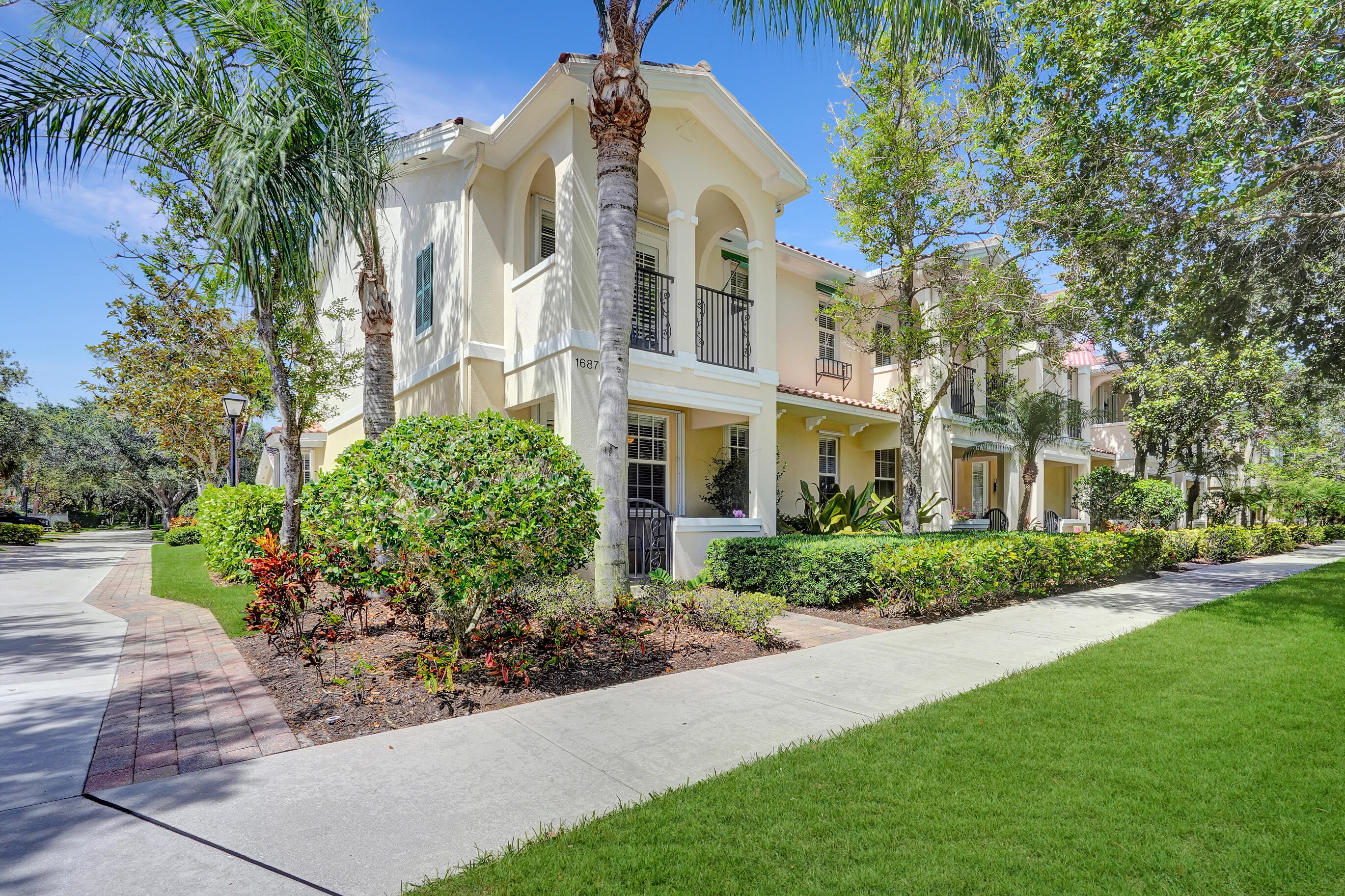 1687 Frederick Small Road Jupiter, FL 33458 - Photo 1 of 27 a view of a building with a yard