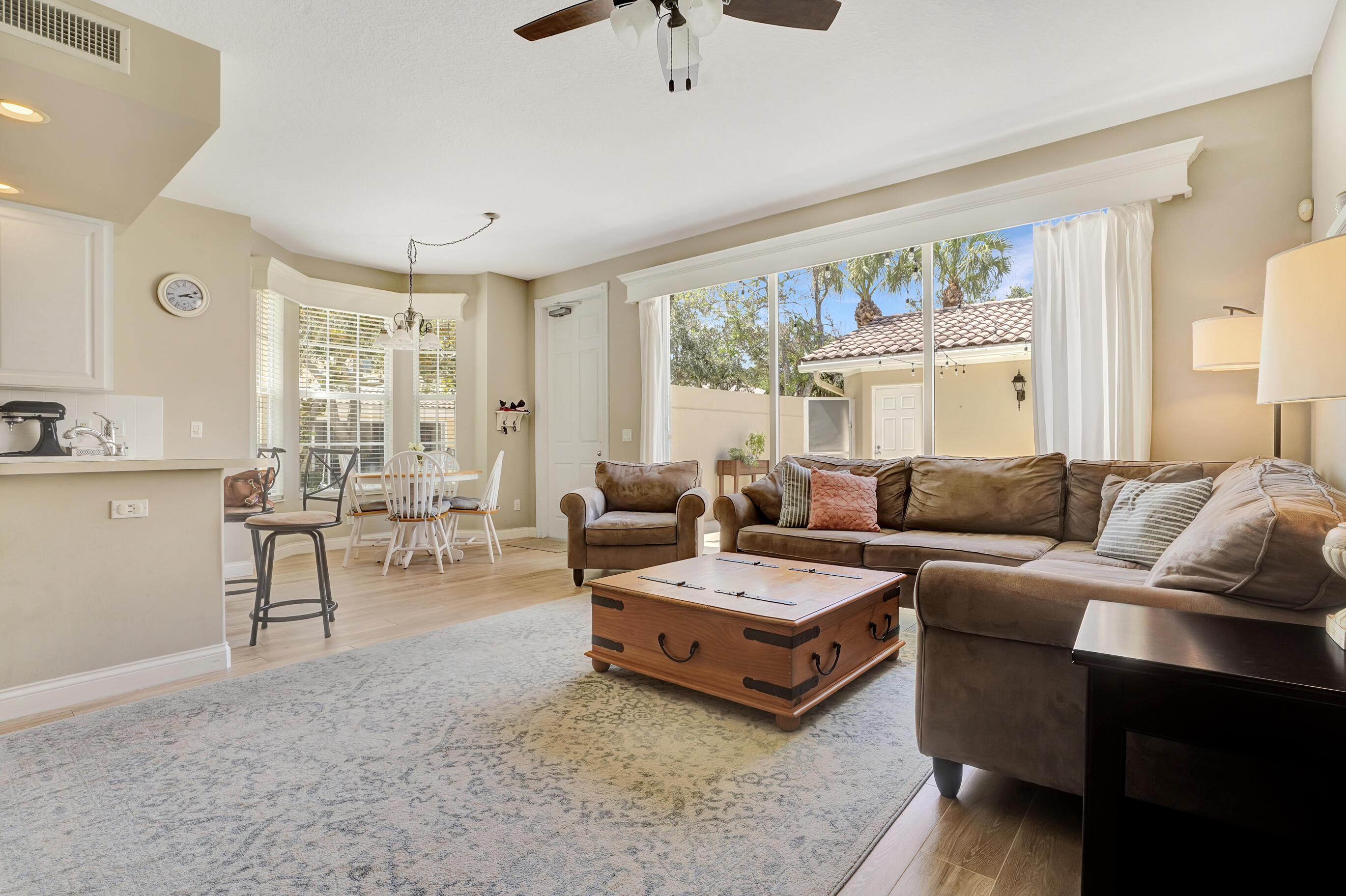 1687 Frederick Small Road Jupiter, FL 33458 - Photo 2 of 27 a living room with furniture and a large window
