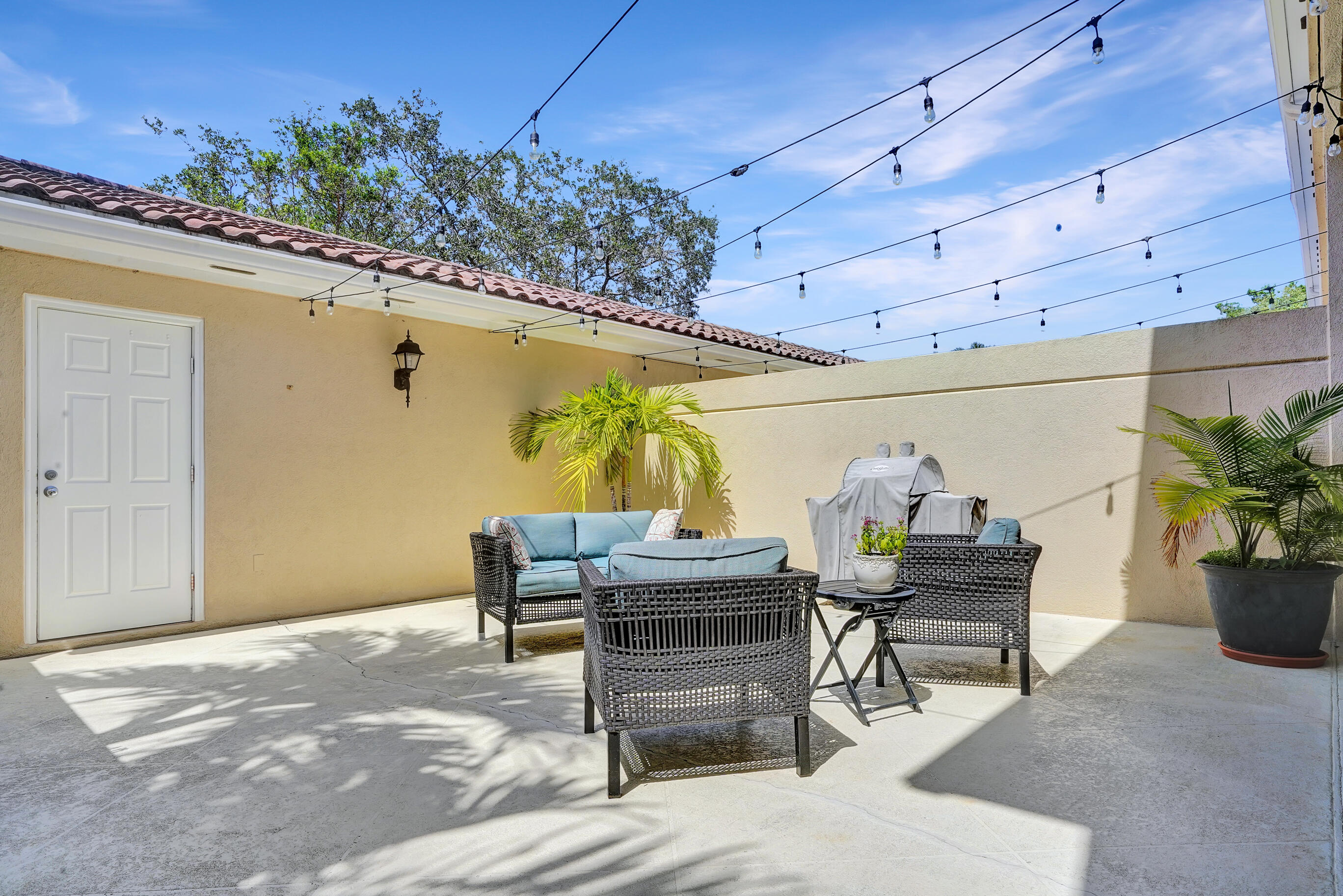 1687 Frederick Small Road Jupiter, FL 33458 - Photo 22 of 27 a outdoor living space with furniture and potted plants