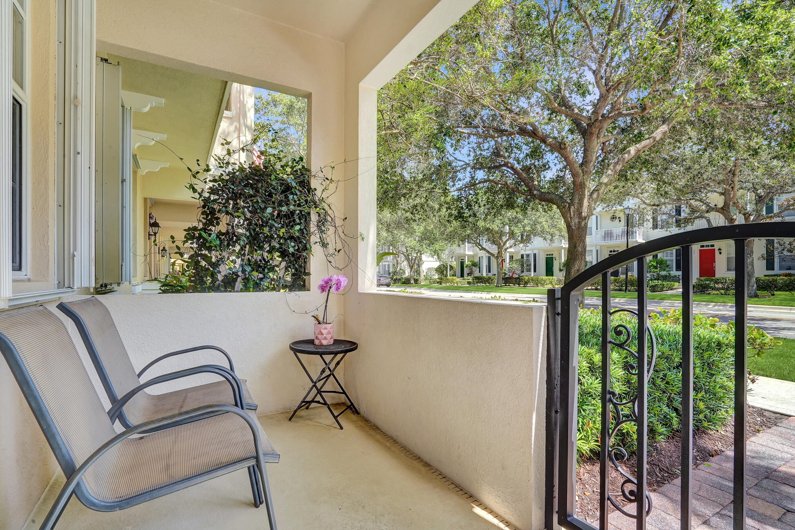 1687 Frederick Small Road Jupiter, FL 33458 - Photo 23 of 27 a balcony view with a large window and outdoor seating