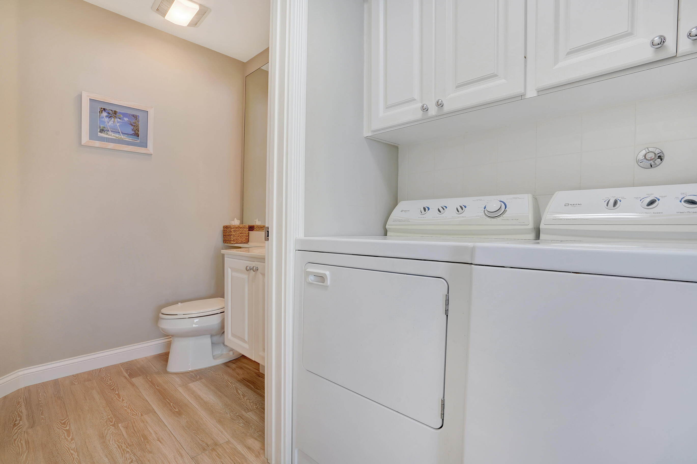1687 Frederick Small Road Jupiter, FL 33458 - Photo 7 of 27 a view of storage and utility room with washer and dryer