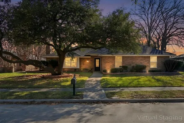 a view of a house with a yard