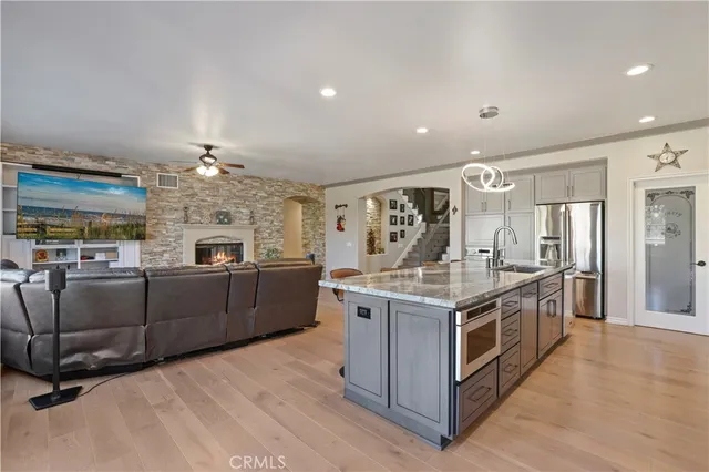 a bed room with a bed and a chandelier