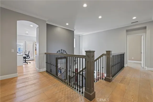 a view of a workspace with furniture and a flat screen tv