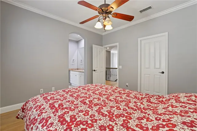 a view of a patio with table and chairs and wooden fence