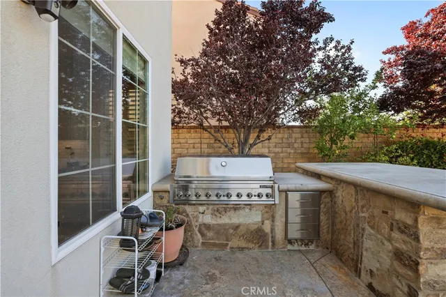 a view of a chairs and table in the patio