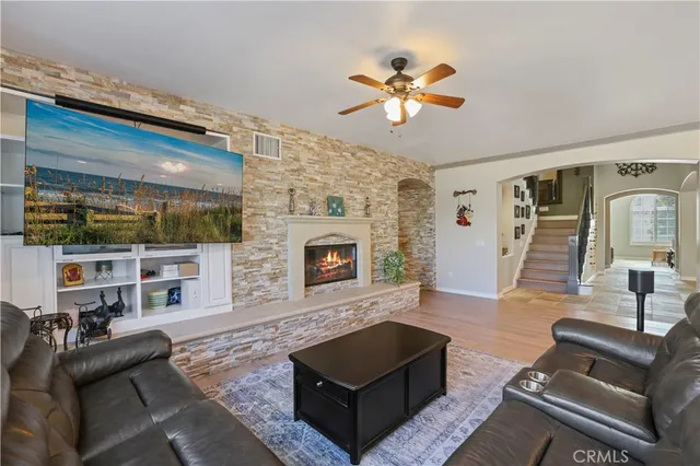 a living room with furniture and a fireplace